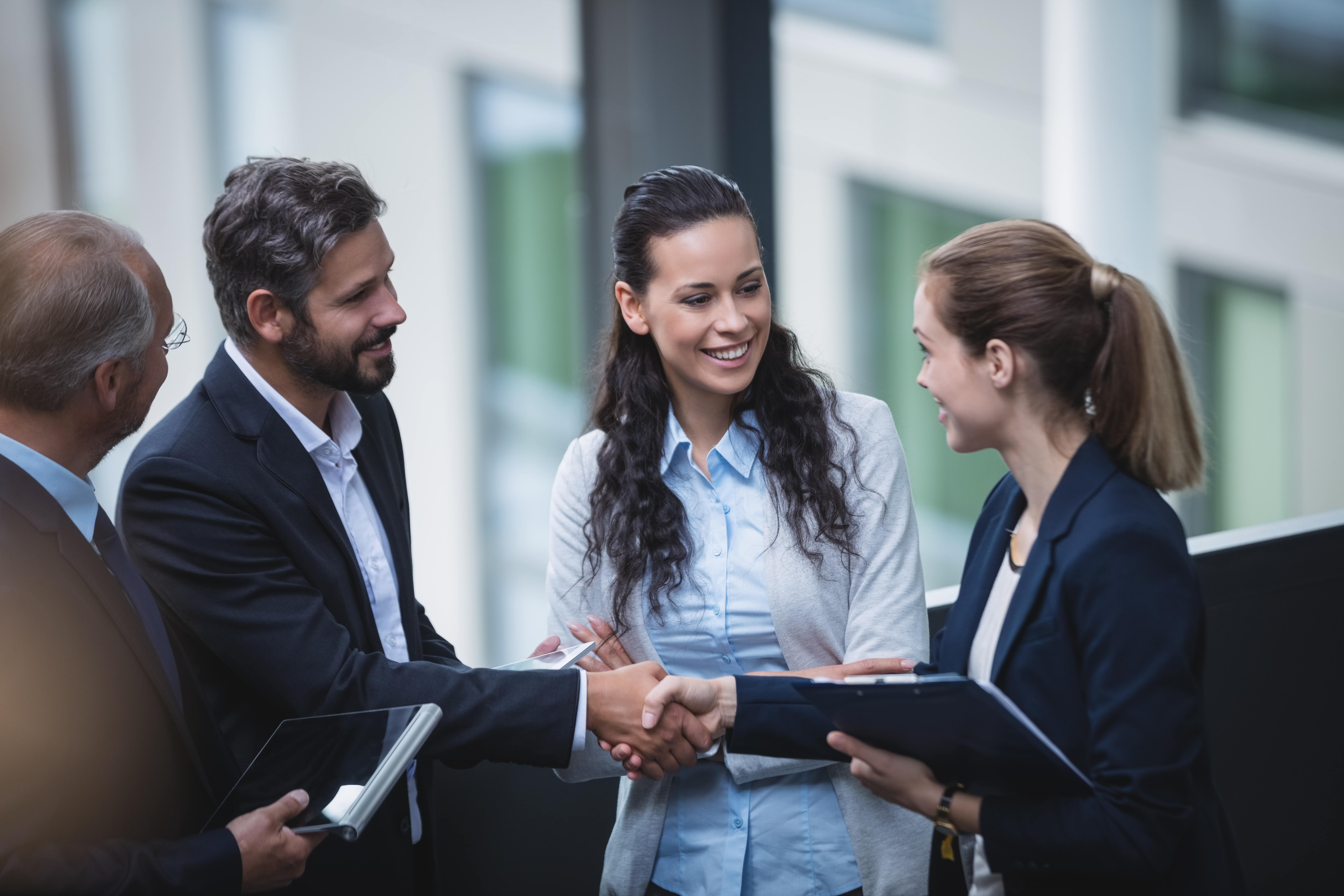 businesspeople-having-discussion-office-min